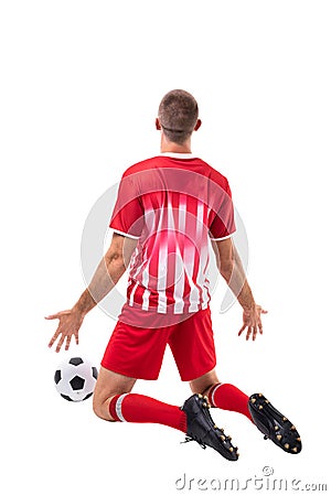 Rear view of male caucasian player celebrating goal by soccer ball over white background Stock Photo