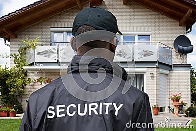 Rear View Of A Male Security Guard Stock Photo