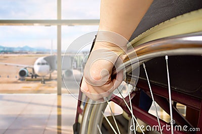 Wheelchair man at airport Stock Photo