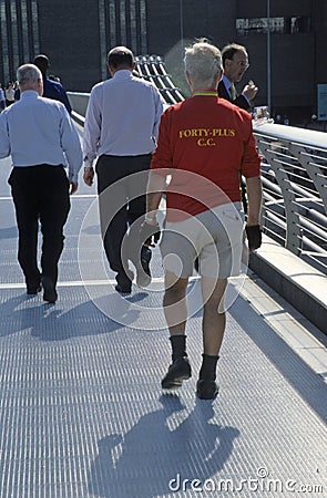 People walking across Millennium Bridge London UK 2003 Editorial Stock Photo