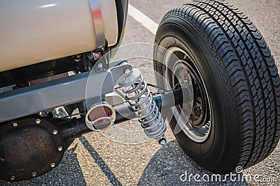 Rear view of old vintage customized hot rod car wheel and other parts Stock Photo