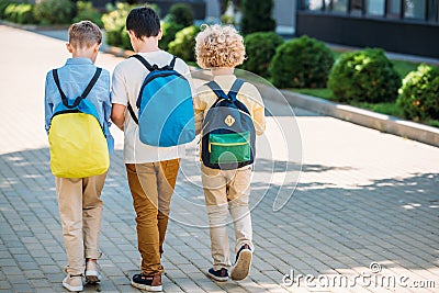 rear view of schoolchboys with backpacks Stock Photo