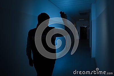 Security Guard Standing In Corridor Of The Building Stock Photo