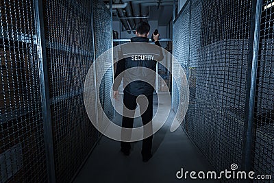 Security Guard Standing In The Warehouse Stock Photo