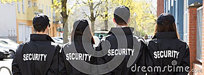 Security Guards Standing In A Row Stock Photo