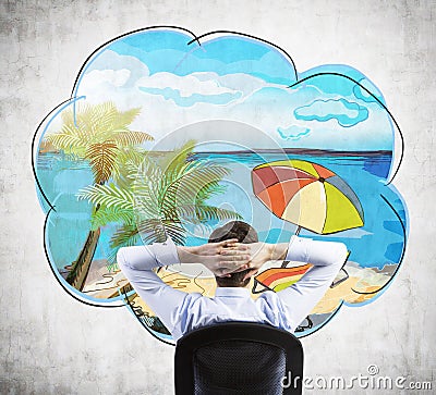 Rear view of sitting businessman who dreams about vacation on the beach. Stock Photo