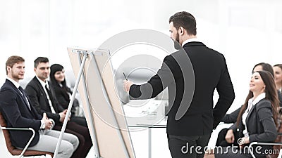 Rear view . the speaker makes a report to the business team Stock Photo