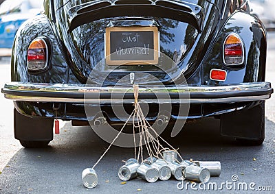 Rear view of a vintage car with just married sign and cans attached Stock Photo