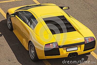 Rear view of a yellow luxury sportcar Editorial Stock Photo