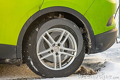 Rear wheel of green Volkswagen ID.4 electric car.. Editorial Stock Photo