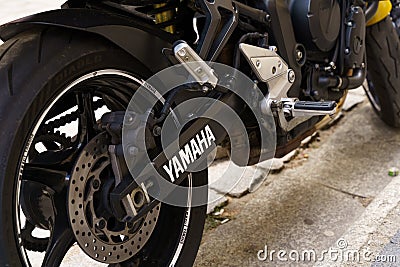 Rear wheel of a Yamaha motorcycle with logo. Editorial Stock Photo