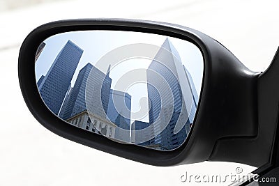Rearview car driving mirror view city downtown Stock Photo