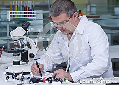 Reasearcher writing Stock Photo