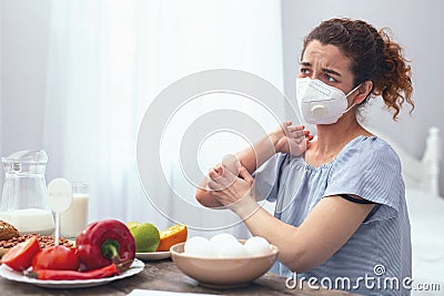 Adolescent lady experiencing allergic itchiness Stock Photo