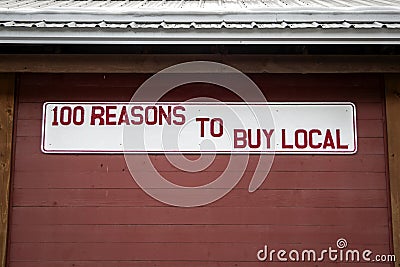 100 Reasons To Buy Local Sign Stock Photo