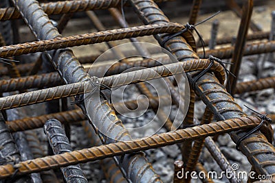 Rebar tie wire work at construction site. Steel bars reinforcing for reinforced concrete and building structures Stock Photo