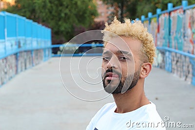 Rebel guy with an afro sticking tongue out Stock Photo