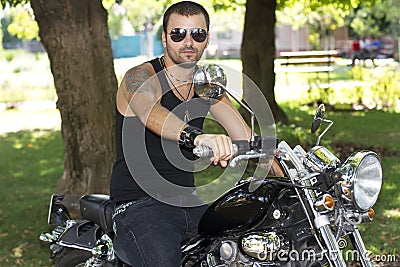 Rebel motorcycle rider on a chopper Stock Photo