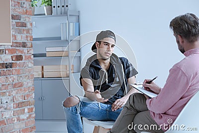 A rebel teenage boy with behavioral problems and criminal past t Stock Photo