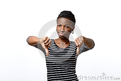 Rebellious negative woman giving a thumbs down Stock Photo