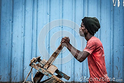 Reboteiro - Boy to make some diliveries in Angola Editorial Stock Photo