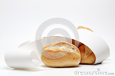 Side view of a wheat bun wrapped into a empty receipt on isolated background, showing german bun and blank receipts to show Stock Photo