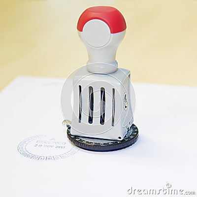 Received date stamp on rubber stamp Stock Photo