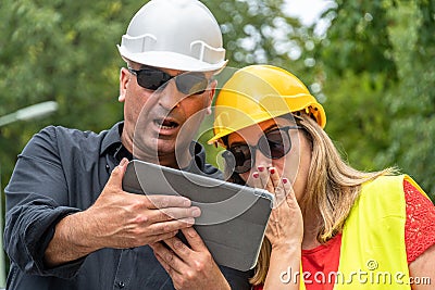 Receiving bad news on construction site Stock Photo