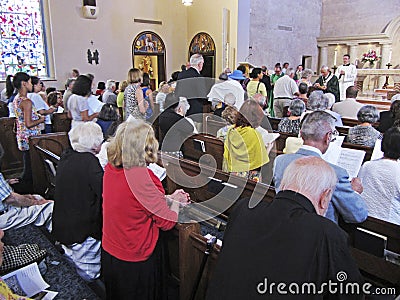 Receiving the Parishioners for Communion Editorial Stock Photo