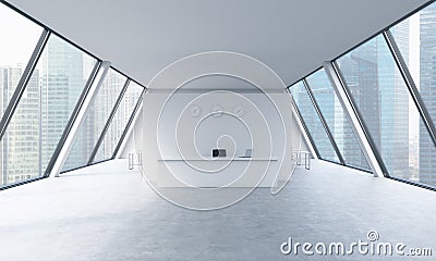 Reception area with clocks and workplaces in a bright modern open space loft office. Stock Photo