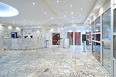 Reception area, glass entrance doors in office building Stock Photo