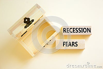 Recession fears symbol. Concept words Recession fears on wooden blocks on a beautiful white table white background. Empty wooden Stock Photo