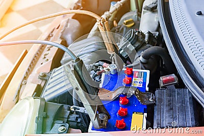 Recharge battery of old car Stock Photo