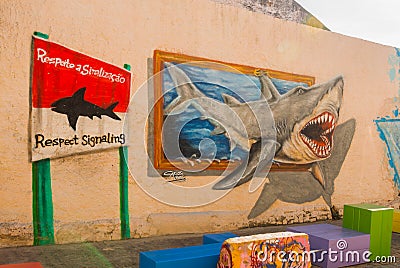Recife, Pernambuco, Brazil: Beautiful graffiti on the wall of the facade of the house. The shark print. Sign danger. Editorial Stock Photo