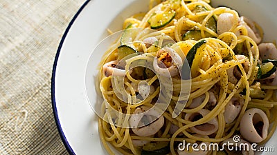 Pasta frutti di mare with calamari and vegetables. Stock Photo