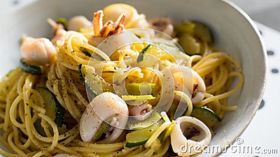 Pasta frutti di mare with calamari and vegetables. Stock Photo