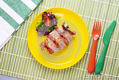 Spiced chicken rolled with bacon cooked in the oven. Stock Photo