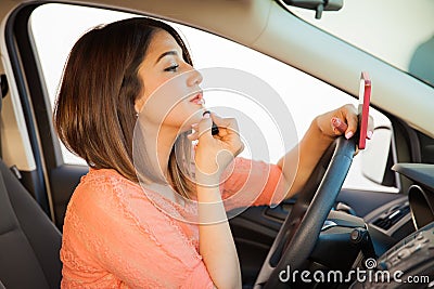 Reckless female driver Stock Photo