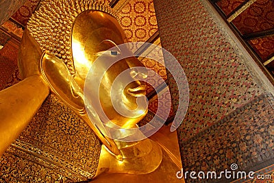 Reclining buddha gold statue Stock Photo