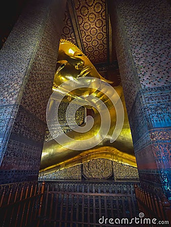 Reclining buddha golden statue In Wat Phra Chetuphon - Thailand Landmark Stock Photo