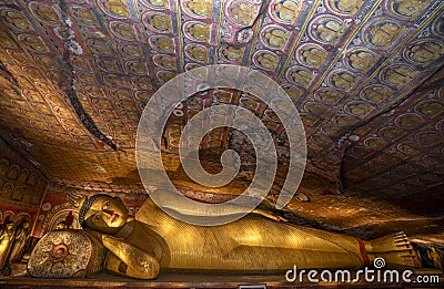 A reclining Buddha statue located in Cave Three at Dambulla Cave Temples. Stock Photo