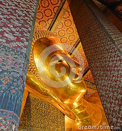 A reclining statue of Buddha in the Ubosot of Phra Chetuphon Vamolmangklararam Temple. Editorial Stock Photo