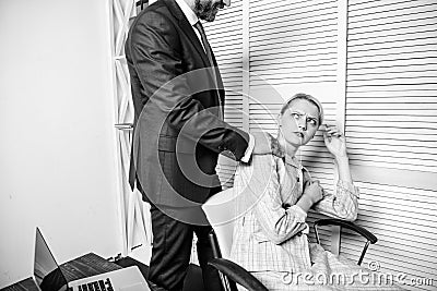 Recognize pursuer. Flirtation or sexual harassment recognize and report. Toxic work environment. Identifying harassment Stock Photo