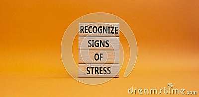 Recognize Signs of Stress symbol. Concept words Recognize Signs of Stress on wooden blocks. Beautiful orange background. Medicine Stock Photo