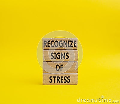 Recognize Signs of Stress symbol. Concept words Recognize Signs of Stress on wooden blocks. Beautiful yellowbackground. Medicine Stock Photo