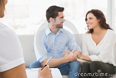 Reconciled couple smiling at each other Stock Photo