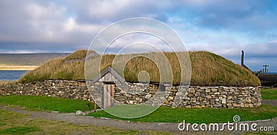 The reconstructed Viking Longhouse near Haroldswick, Unst, Shetland, Scotland, UK Editorial Stock Photo