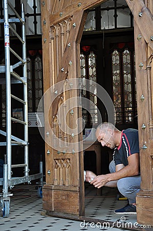 Reconstruction of the old doors of the church Editorial Stock Photo