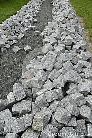 Reconstruction of a pack sidewalk with cobbles Stock Photo