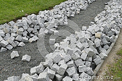 Reconstruction of a pack sidewalk with cobbles Stock Photo